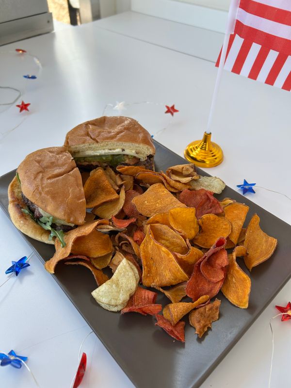 A green hatch chili bacon burger with home-fried chips